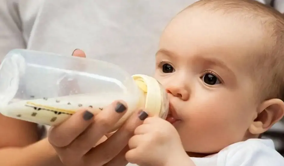 The baby is drinking formula
