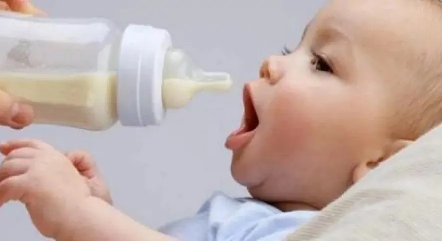 The child is drinking formula